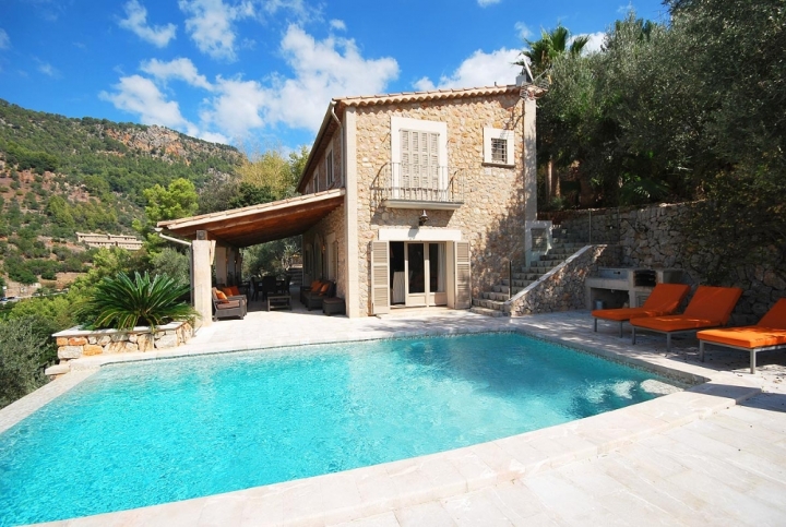 Deià country villa in traditional style with natural stone facade